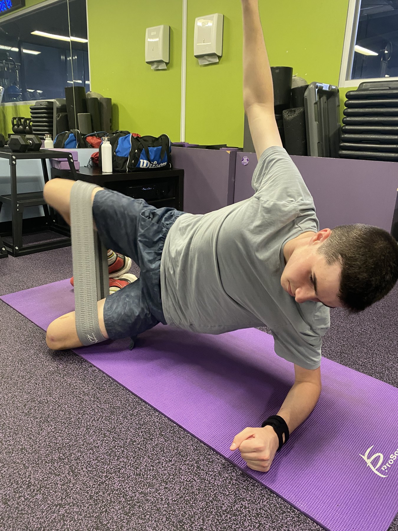 A younger Hamish completing an early trunk and hip-control exercise