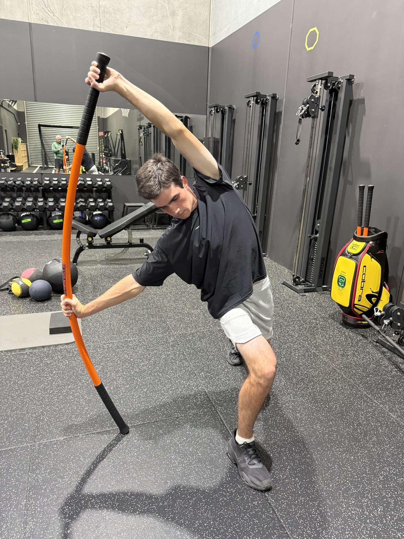 Hamish completing a golf-specific rotational movement exercise